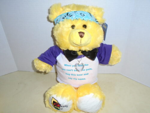 brian and briana yellow bear with a heart pendant