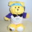 brian and briana yellow bear with a heart pendant